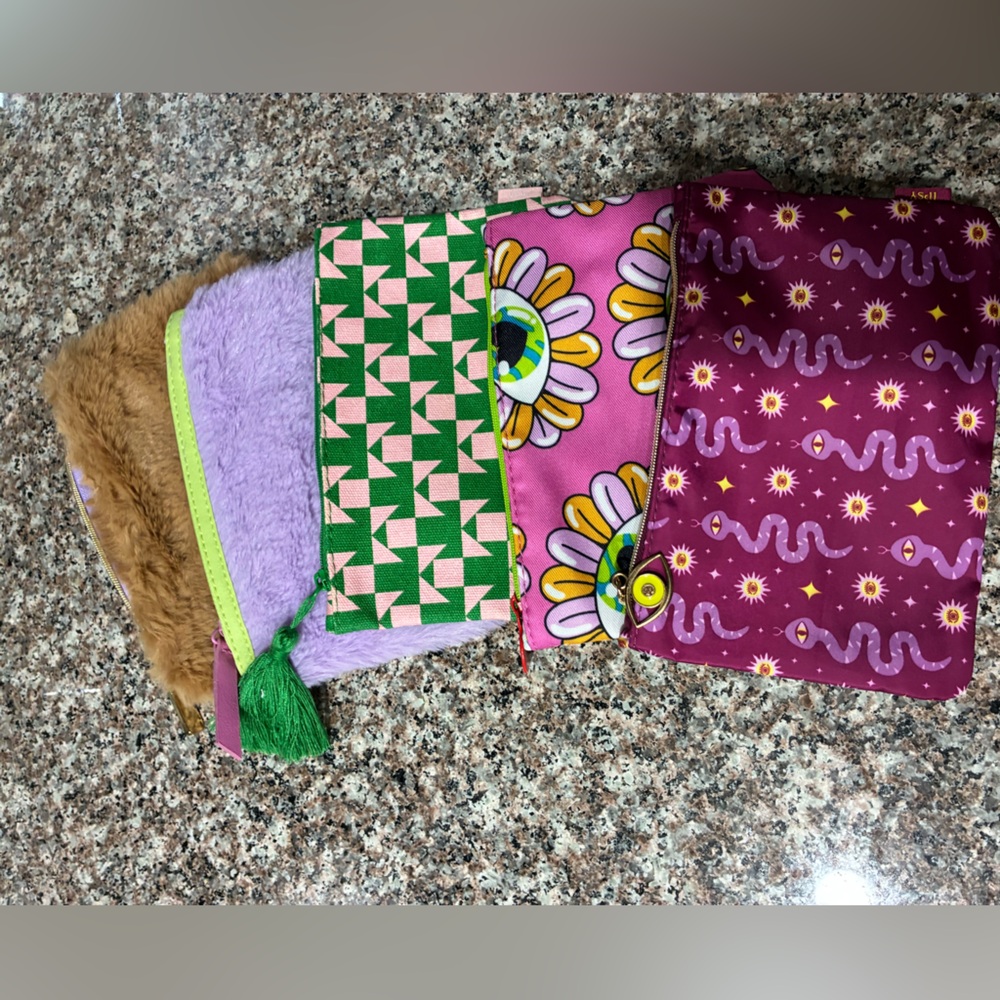 Five Ipsy Travel/Make Up Bags

Brown & Purple Fluffy,Green/Pink,Eyes,Snake Eyes